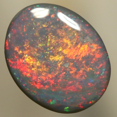 SOLID SEMI BLACK OPAL Red and orange moves constantly over green 